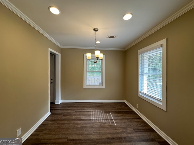 unfurnished dining area featuring a chandelier, dark hardwood / wood-style floors, and ornamental molding