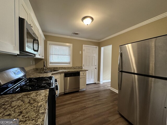 1764 Thomas Ter, Decatur, GA 30032 - kitchen featuring stainless steel appliances, a sink, ornamental molding, white cabinetry, and dark wood finished floors