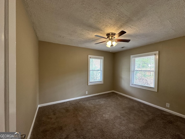 1764 Thomas Ter, Decatur, GA 30032 - spare room with a textured ceiling, healthy amount of natural light, ceiling fan, and dark carpet