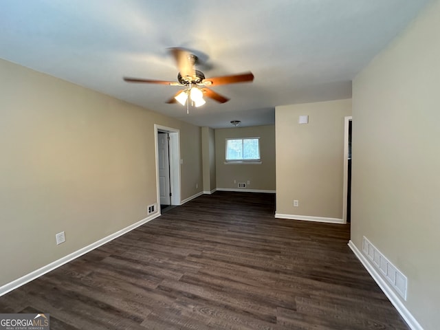 unfurnished room with ceiling fan and dark hardwood / wood-style flooring