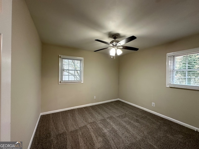 spare room featuring carpet flooring, plenty of natural light, and ceiling fan