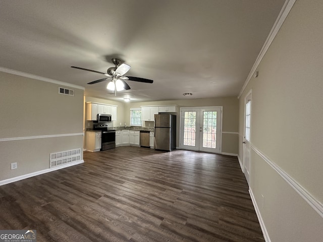 4433 Mercer Rd, Decatur, GA 30035 - unfurnished living room with baseboards, ceiling fan, crown molding, and dark wood-style flooring