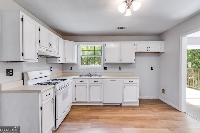 kitchen featuring white appliances, light hardwood / wood-style floors, white cabinetry, and sink