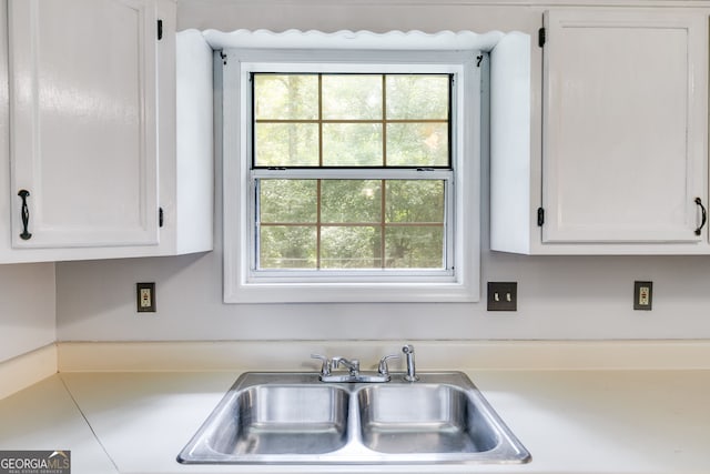 kitchen with white cabinets and sink