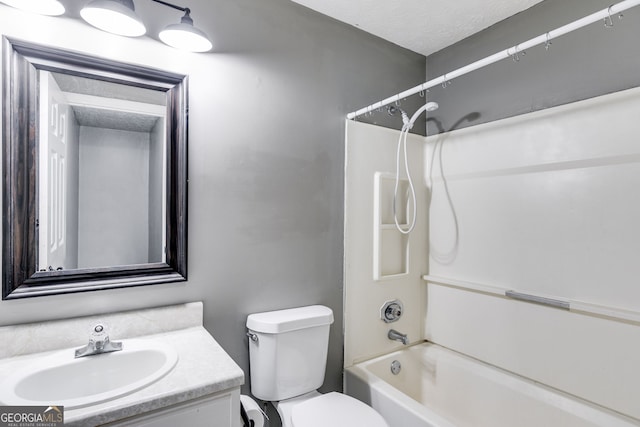 full bathroom featuring vanity, shower / bathtub combination, toilet, and a textured ceiling