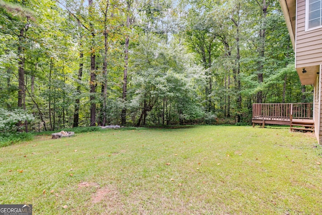 view of yard featuring a wooden deck