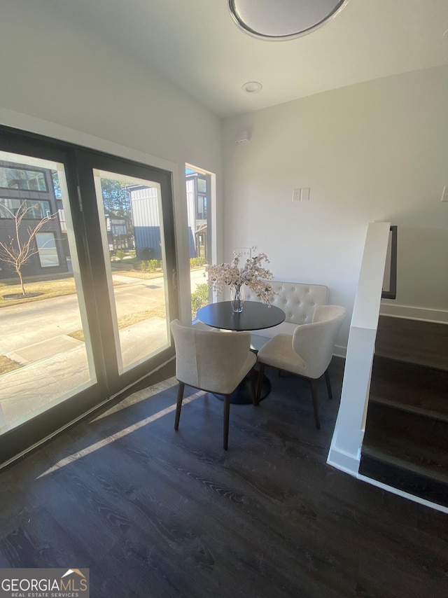 dining area featuring dark wood-type flooring