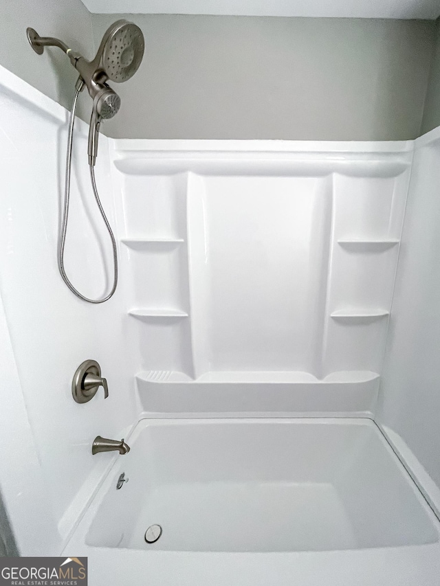 full bathroom with washtub / shower combination