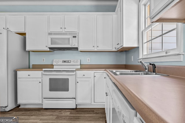 kitchen with dark hardwood / wood-style flooring, white cabinets, and white appliances