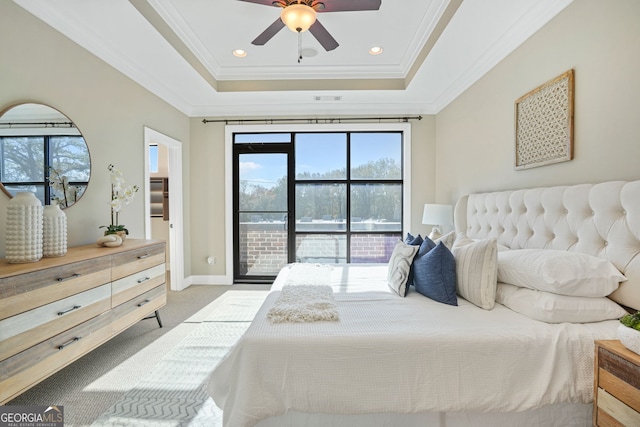 carpeted bedroom featuring access to outside, a raised ceiling, ceiling fan, and crown molding