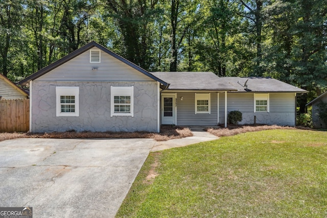 ranch-style home with a front yard