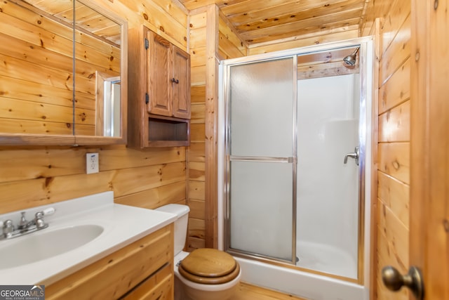 bathroom with an enclosed shower, vanity, wooden ceiling, toilet, and wood walls