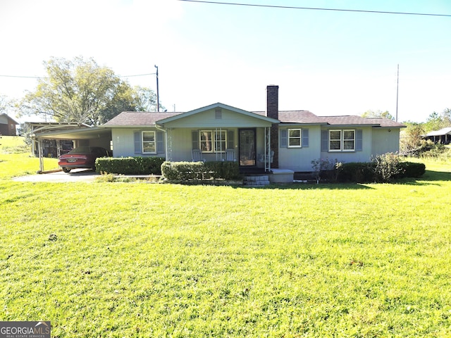 view of front of property featuring a carport, covered porch, and a front yard