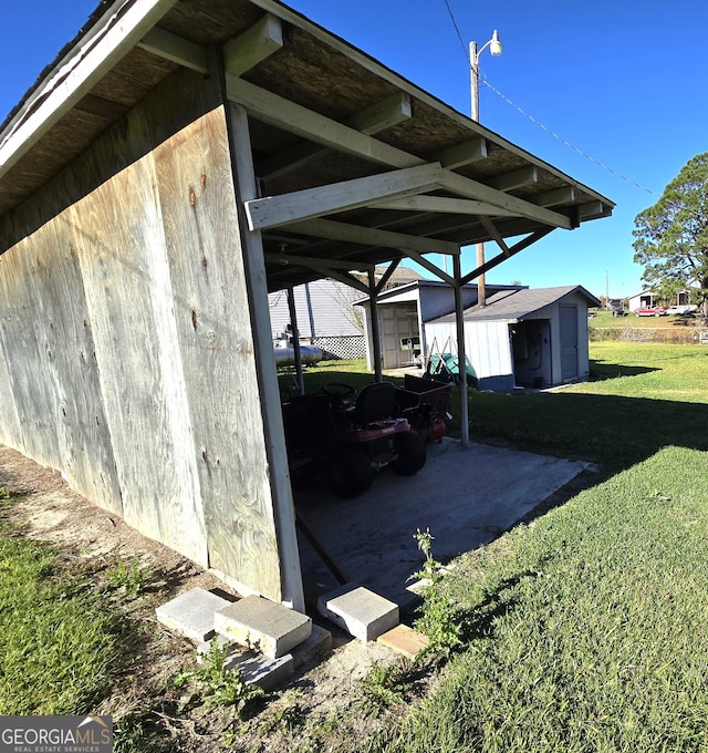 view of parking / parking lot with a lawn