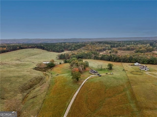 birds eye view of property featuring a rural view