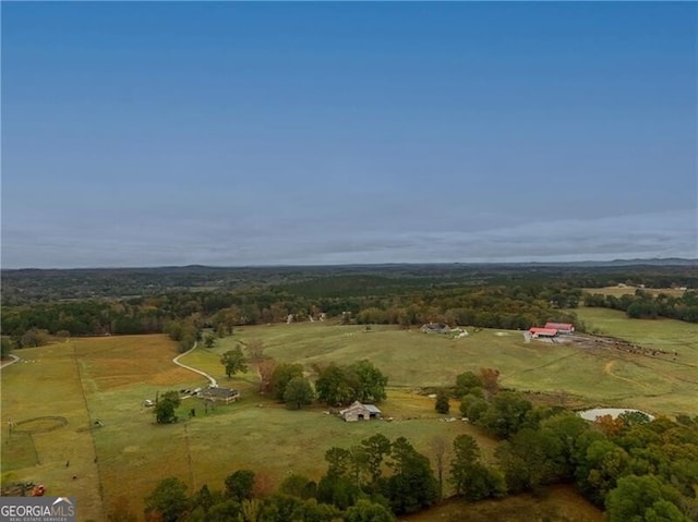 birds eye view of property featuring a rural view