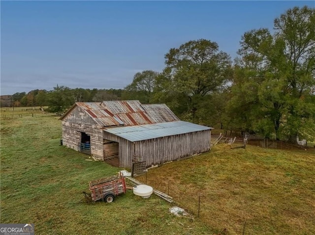 view of outbuilding with a lawn