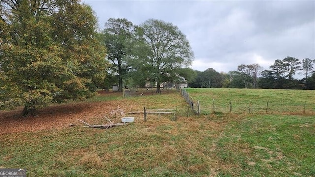 view of yard with a rural view