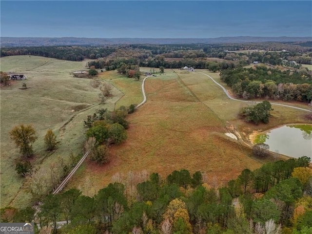 bird's eye view featuring a rural view and a water view