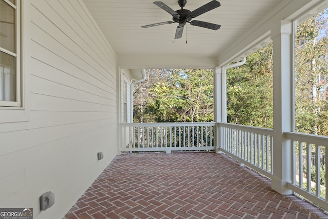 view of patio featuring ceiling fan and a porch