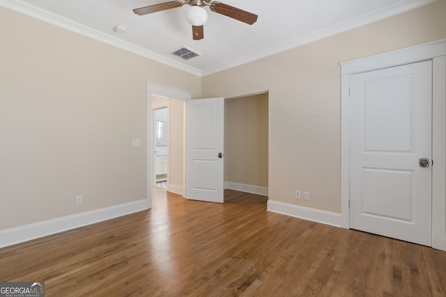 unfurnished bedroom featuring ceiling fan, hardwood / wood-style floors, and ornamental molding