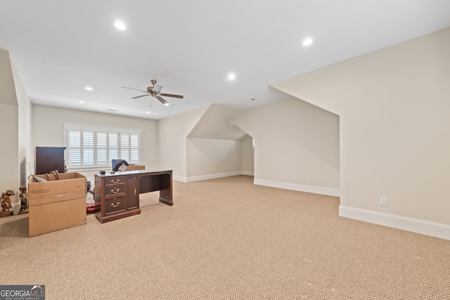 bonus room with ceiling fan and light colored carpet