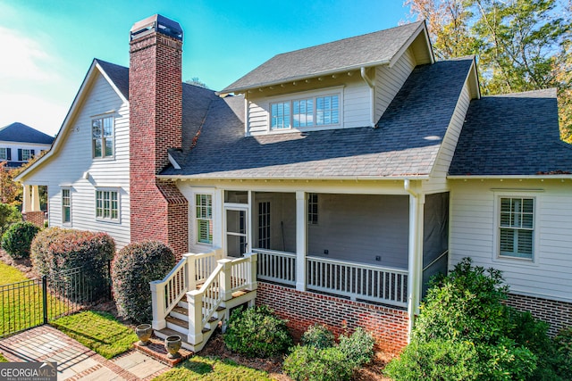 view of front facade with a sunroom