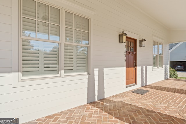 doorway to property featuring covered porch