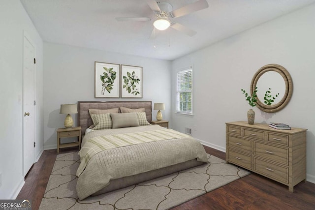 bedroom with dark hardwood / wood-style floors and ceiling fan