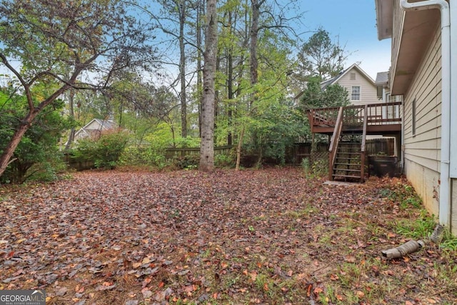 view of yard featuring a wooden deck