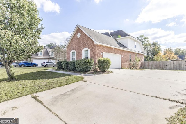 view of side of property featuring a yard