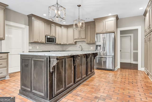 kitchen featuring backsplash, a center island, stainless steel appliances, and decorative light fixtures