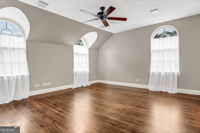 bonus room featuring ceiling fan, dark hardwood / wood-style flooring, and vaulted ceiling