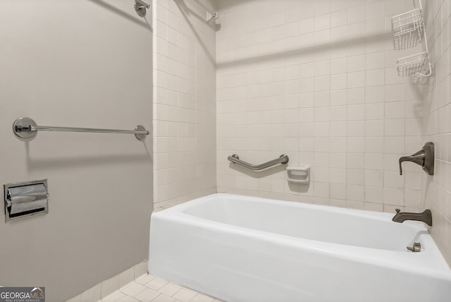 bathroom with tile patterned flooring and tiled shower / bath combo