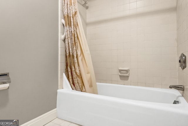 bathroom with tile patterned floors and shower / tub combo with curtain