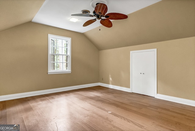 bonus room featuring ceiling fan, hardwood / wood-style floors, and lofted ceiling