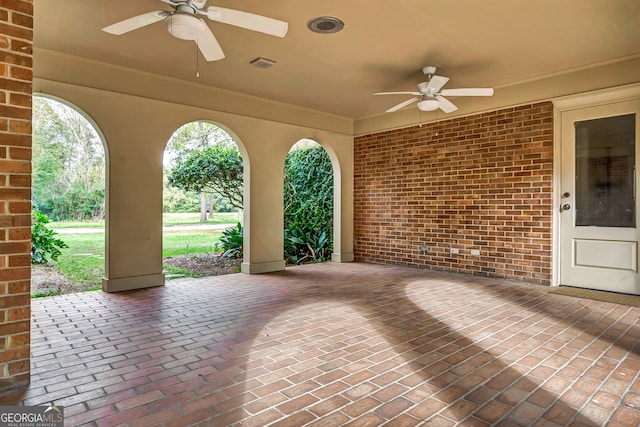 view of patio featuring ceiling fan