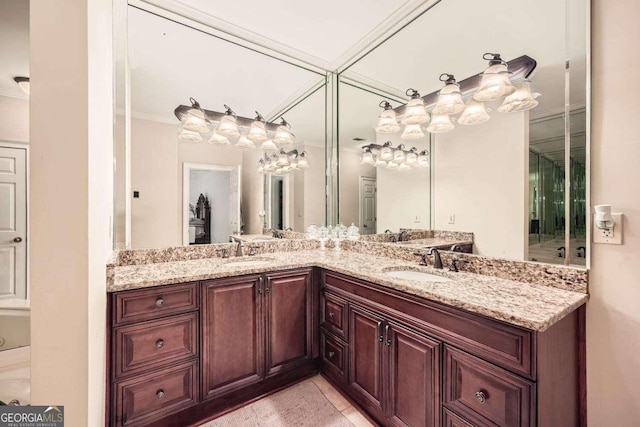 bathroom featuring crown molding and vanity