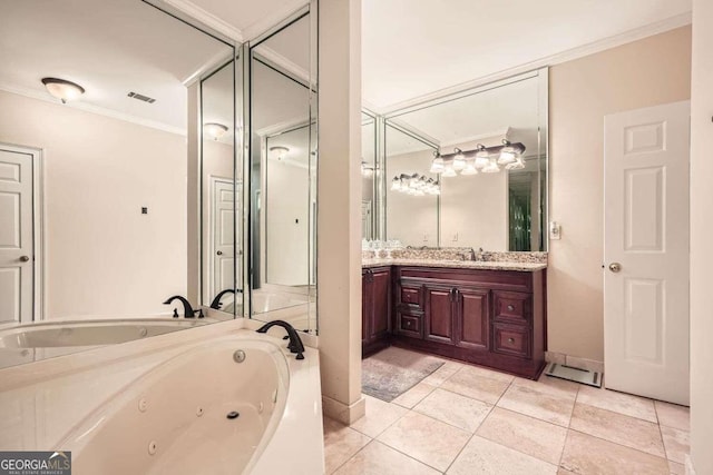 bathroom with vanity, a tub to relax in, tile patterned floors, and ornamental molding