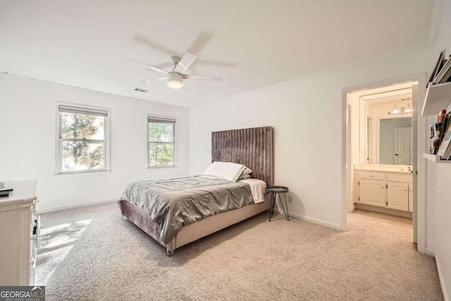 carpeted bedroom featuring connected bathroom, ceiling fan, and ornamental molding