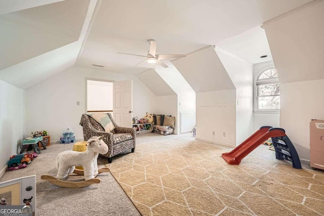 recreation room with ceiling fan, carpet, and lofted ceiling