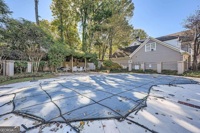 view of swimming pool with a patio