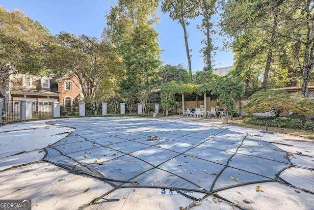 view of swimming pool featuring a patio area