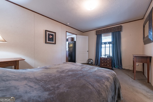 bedroom featuring black fridge, light colored carpet, a textured ceiling, and ornamental molding