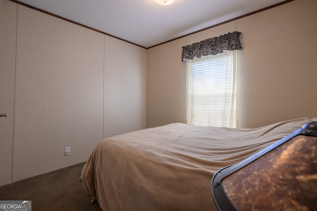 carpeted bedroom with lofted ceiling and ornamental molding