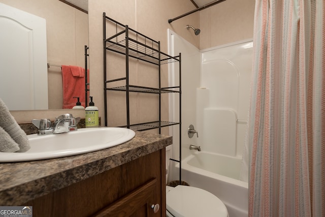 full bathroom featuring vanity, shower / bath combination with curtain, and toilet