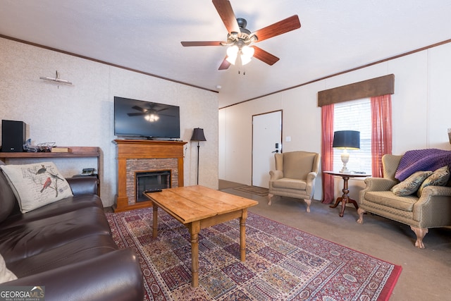 living room with a stone fireplace, a textured ceiling, and ornamental molding