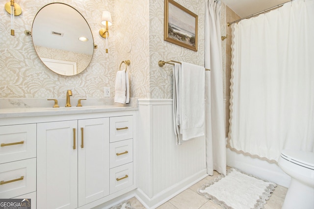 full bathroom with tile patterned flooring, vanity, shower / bath combination with curtain, and toilet