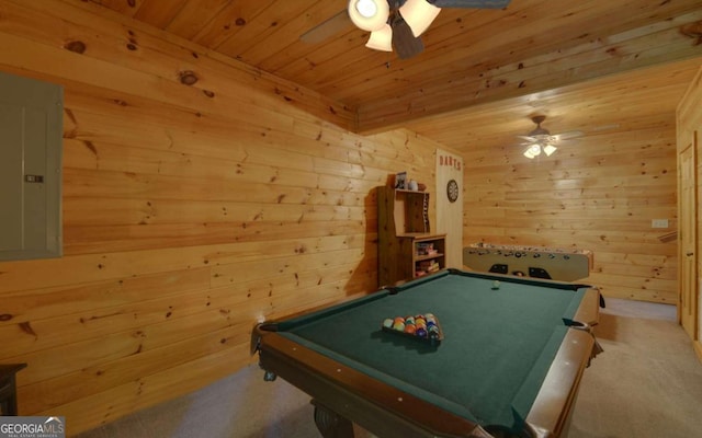 rec room with wooden walls, ceiling fan, and pool table