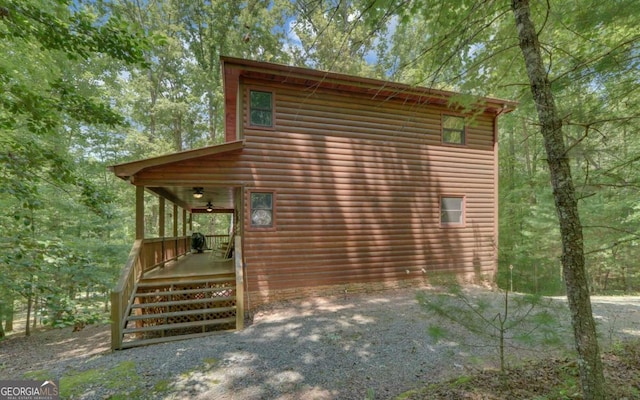 view of side of home with covered porch